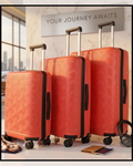 Coral Maze 3-piece coral red suitcase set with telescopic handles in 57, 69 and 78 inches.