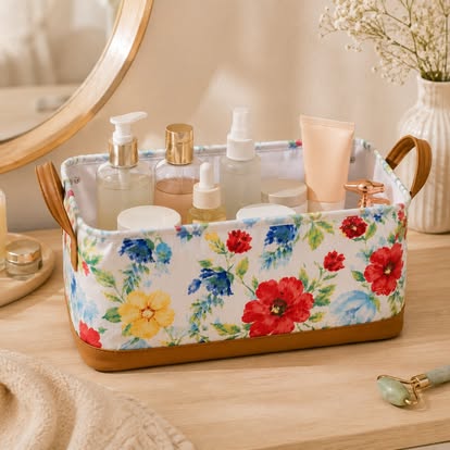 Floral storage basket with side handles for organizing towels, clothing, toiletries, toys, and household essentials.