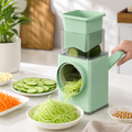 Manual rotary vegetable slicer with stainless steel drum blades