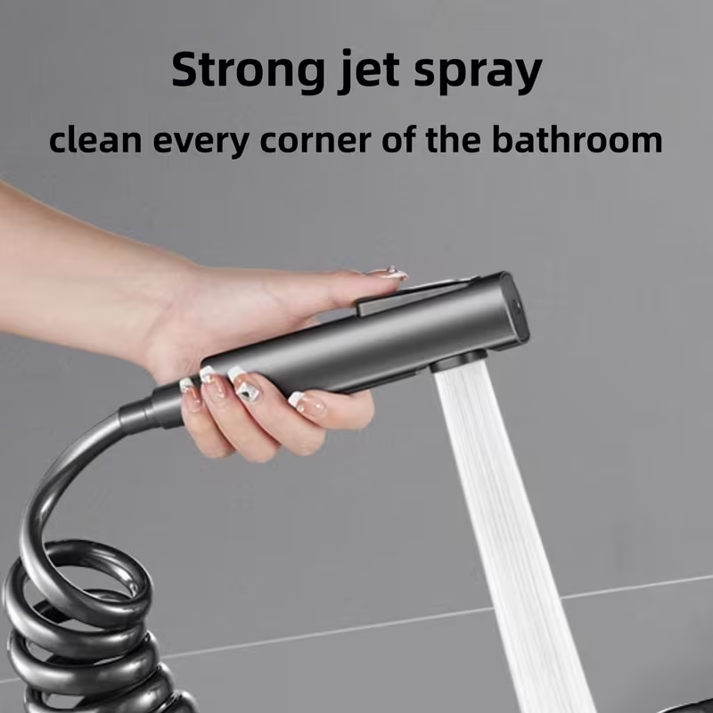 Matte black rainfall shower system with handheld bidet spray and flexible hose.