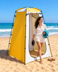 

changing-tent-in-use.jpg

Woman stepping out of a yellow and white beach changing tent