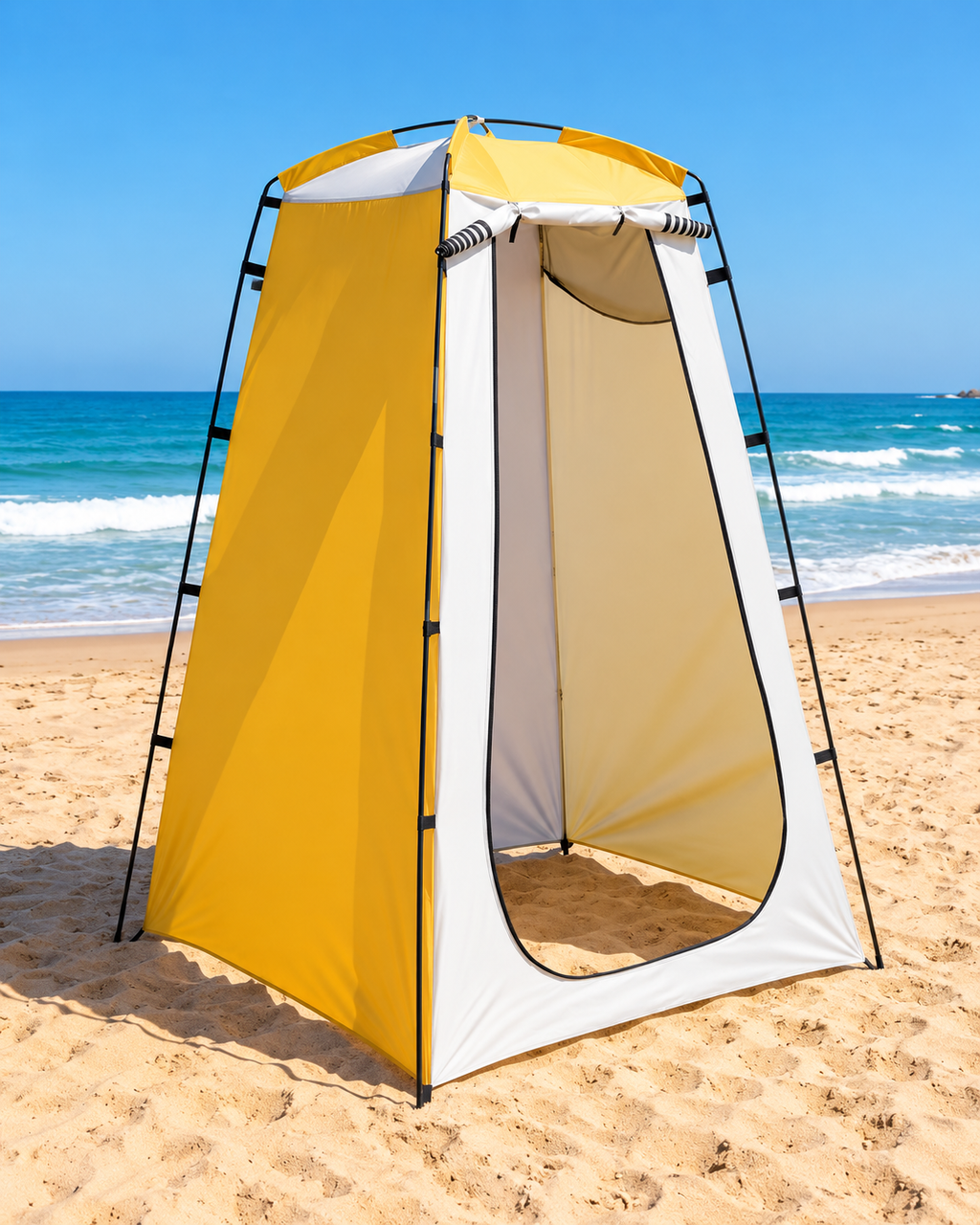 Yellow and white portable changing tent set up on a sandy beach